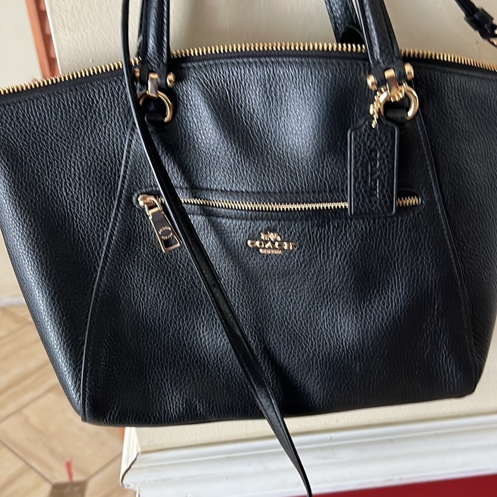 Black Coach Prairie Convertible with gold.
